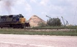 CSX 8063 going by an active dragline